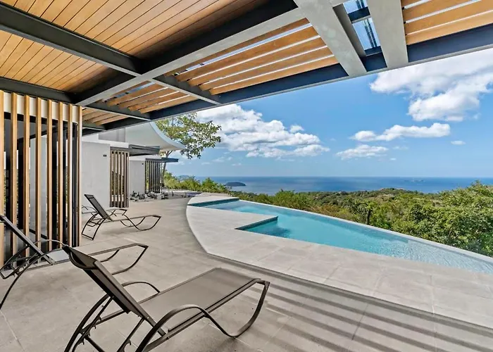 Luxurious Ultramodern Property With Private Suites, Infinity Pool, And Sweeping Ocean And Mountain Views