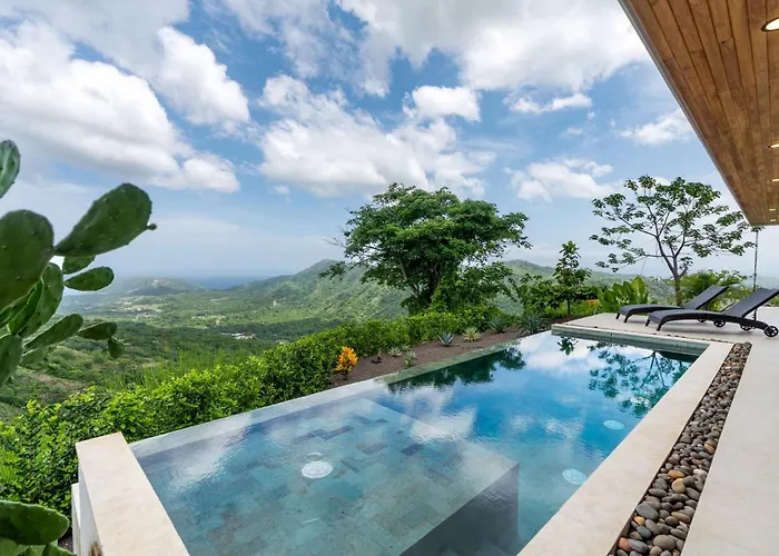 Mountainside Home With Modern Design Sweeping Ocean Views & Private Swimming Pool