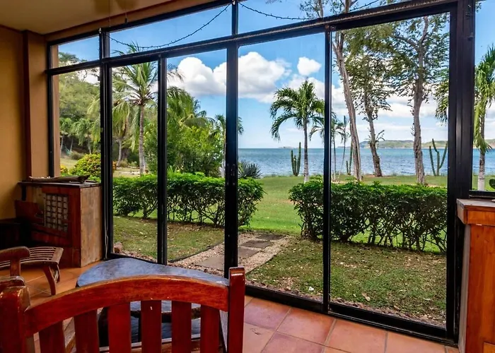 Beachfront Condo With Warm, Rustic Interiors & Direct Access To Playa Flamingo