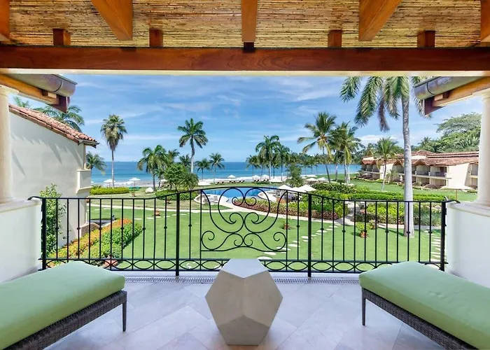 Modern Oceanfront Condo With A Chic Coastal Design, Resort-Style Amenities, And Direct Beach Access